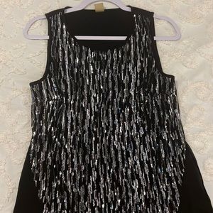 Sequined sleeveless top. Size is small but fits like a medium